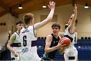 2 March 2022; Jacob Byrne of Rathmore in action against Sean Connolly, left, and Ruairi Collins of Skibbereen during the Basketball Ireland U16B Boys Schools League Final match between Skibbereen Community School, Cork, and Rathmore Grammar School, Belfast, at the National Basketball Arena in Dublin. Photo by Seb Daly/Sportsfile