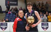 2 March 2022; Rathmore Grammar School captain Jacob Byrne is presented with the MVP award by Casey Tryon, development officer, Basketball Ireland, after the Basketball Ireland U16B Boys Schools League Final match between Skibbereen Community School, Cork, and Rathmore Grammar School, Belfast, at the National Basketball Arena in Dublin. Photo by Seb Daly/Sportsfile