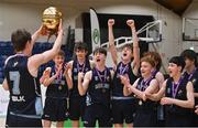 2 March 2022; Rathmore Grammar School captain Jacob Byrne returns to his teammates with the MVP award after their side's victory in the Basketball Ireland U16B Boys Schools League Final match between Skibbereen Community School, Cork, and Rathmore Grammar School, Belfast, at the National Basketball Arena in Dublin. Photo by Seb Daly/Sportsfile