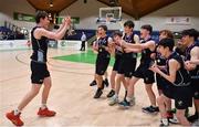 2 March 2022; Rathmore Grammar School captain Jacob Byrne returns to his teammates with the cup after their side's victory in the Basketball Ireland U16B Boys Schools League Final match between Skibbereen Community School, Cork, and Rathmore Grammar School, Belfast, at the National Basketball Arena in Dublin. Photo by Seb Daly/Sportsfile