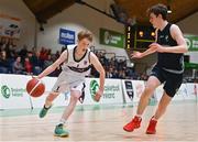 2 March 2022; Finn Brickley of Skibbereen in action against Jacob Byrne of Rathmore during the Basketball Ireland U16B Boys Schools League Final match between Skibbereen Community School, Cork, and Rathmore Grammar School, Belfast, at the National Basketball Arena in Dublin. Photo by Seb Daly/Sportsfile