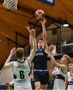 2 March 2022; Jacob Byrne of Rathmore in action against Sean Connolly, left, and Daniel Hurley of Skibbereen during the Basketball Ireland U16B Boys Schools League Final match between Skibbereen Community School, Cork, and Rathmore Grammar School, Belfast, at the National Basketball Arena in Dublin. Photo by Seb Daly/Sportsfile