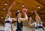 2 March 2022; Conn Rush of Rathmore in action against Shaun Hoddnett, left, and Daniel Hurley of Skibbereen during the Basketball Ireland U16B Boys Schools League Final match between Skibbereen Community School, Cork, and Rathmore Grammar School, Belfast, at the National Basketball Arena in Dublin. Photo by Seb Daly/Sportsfile