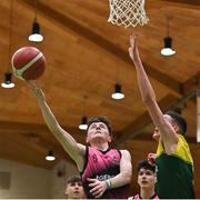 2 March 2022; Adam O’Rourke of St Munchin's in action against Conor Barrett of Gortnor Abbey during the Basketball Ireland U19B Boys Schools League Final match between Gortnor Abbey Secondary School, Mayo, and St Munchin's College, Limerick, at the National Basketball Arena in Dublin. Photo by Seb Daly/Sportsfile