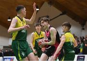 2 March 2022; Liam Price of St Munchin's in action against Conor Barrett, left, and Jack O’Shea of Gortnor Abbey during the Basketball Ireland U19B Boys Schools League Final match between Gortnor Abbey Secondary School, Mayo, and St Munchin's College, Limerick, at the National Basketball Arena in Dublin. Photo by Seb Daly/Sportsfile