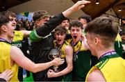 2 March 2022; Gortnor Abbey captain Niall Coggins, centre, celebrates with teammates and supporters after their side's victory in the Basketball Ireland U19B Boys Schools League Final match between Gortnor Abbey Secondary School, Mayo, and St Munchin's College, Limerick, at the National Basketball Arena in Dublin. Photo by Seb Daly/Sportsfile