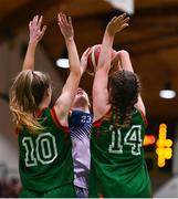 3 March 2022; Ava Walshe of Regina Mundi is blocked by Calasanctius College players Jessica Ross, left, and Kate Burke during the Basketball Ireland U16A Girls Schools League Final match between Calasanctius College, Galway and Regina Mundi, Cork at the National Basketball Arena in Dublin. Photo by Ben McShane/Sportsfile