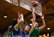 3 March 2022; Kate Burke of Calasanctius College in action against Caoimhe Fraher of Regina Mundi during the Basketball Ireland U16A Girls Schools League Final match between Calasanctius College, Galway and Regina Mundi, Cork at the National Basketball Arena in Dublin. Photo by Ben McShane/Sportsfile