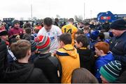 27 February 2022; Austin Gleeson of Waterford and Neil McManus of Antrim sign autographs for young supporters after the Allianz Hurling League Division 1 Group B match between Antrim and Waterford at Corrigan Park in Belfast. Photo by Oliver McVeigh/Sportsfile