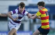 4 March 2022; Ross Doyle of Clongowes Wood College is tackled by Jack Caffrey of Temple Carrig during the Bank of Ireland Leinster Rugby Schools Junior Cup 1st Round match between Temple Carrig, Wicklow and Clongowes Wood College, Kildare at Energia Park in Dublin. Photo by Daire Brennan/Sportsfile