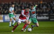 4 March 2022; Darragh Burns of St Patrick's Athletic in action against Dylan Watts of Shamrock Rovers during the SSE Airtricity League Premier Division match between St Patrick's Athletic and Shamrock Rovers at Richmond Park in Dublin. Photo by Seb Daly/Sportsfile