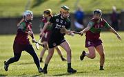5 March 2022; Kate Lynch of Clanmaurice in action against Niamh Leen, left, and Edel Slattery of Eoghan Rua during the 2021 AIB Junior Club Camogie A Championship Final match between Clanmaurice, Kerry, and Eoghan Rua, Derry, at O'Raghallaigh's GAA club in Drogheda, Louth. Photo by Piaras Ó Mídheach/Sportsfile