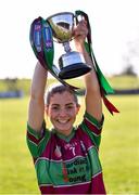 5 March 2022; Eoghan Rua captain Éilis McNamee lifts the cup after the 2021 AIB Junior Club Camogie A Championship Final match between Clanmaurice, Kerry, and Eoghan Rua, Derry, at O'Raghallaigh's GAA club in Drogheda, Louth. Photo by Piaras Ó Mídheach/Sportsfile