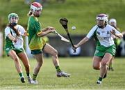 5 March 2022; Aobha Harmon of Knockananna in action against Rachel O'Neill, left, and Bronagh Carney of Derrylaughan during the 2021 AIB Junior Club Camogie B Championship Final match between Derrylaughan, Tyrone, and Knockananna, Wicklow, at O'Raghallaigh's GAA club in Drogheda, Louth. Photo by Piaras Ó Mídheach/Sportsfile