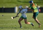 5 March 2022; Áine Hegarty of Derrylaughan in action against Rachel Byrne of Knockananna during the 2021 AIB Junior Club Camogie B Championship Final match between Derrylaughan, Tyrone, and Knockananna, Wicklow, at O'Raghallaigh's GAA club in Drogheda, Louth. Photo by Piaras Ó Mídheach/Sportsfile