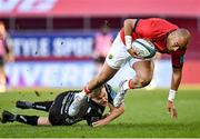 5 March 2022; Simon Zebo of Munster is tackled by Will Talbot-Davies of Dragons during the United Rugby Championship match between Munster and Dragons at Thomond Park in Limerick. Photo by Seb Daly/Sportsfile