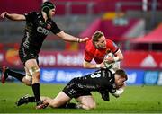 5 March 2022; Mike Haley of Munster is tackled by Joe Maksymiw, left, and Jack Dixon of Dragons during the United Rugby Championship match between Munster and Dragons at Thomond Park in Limerick. Photo by Seb Daly/Sportsfile