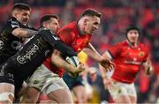 5 March 2022; Chris Farrell of Munster scores his side's sixth try despite the tackle of Josh Lewis of Dragons during the United Rugby Championship match between Munster and Dragons at Thomond Park in Limerick. Photo by Brendan Moran/Sportsfile