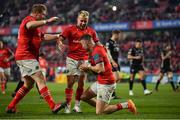 5 March 2022; Shane Daly of Munster, right, celebrates with teammates Stephen Archer and Craig Casey after scoring their side's seventh try during the United Rugby Championship match between Munster and Dragons at Thomond Park in Limerick. Photo by Brendan Moran/Sportsfile