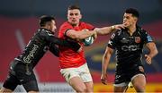 5 March 2022; Shane Daly of Munster is tackled by Jordan Williams, left, and Rio Dyer of Dragons during the United Rugby Championship match between Munster and Dragons at Thomond Park in Limerick. Photo by Brendan Moran/Sportsfile