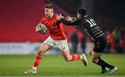 5 March 2022; Jack Crowley of Munster is tackled by Sam Davies of Dragons during the United Rugby Championship match between Munster and Dragons at Thomond Park in Limerick. Photo by Brendan Moran/Sportsfile