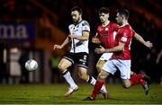 5 March 2022; Robbie Benson of Dundalk in action against Niall Morahan, centre, and Karl O'Sullivan of Sligo Rovers during the SSE Airtricity League Premier Division match between Sligo Rovers and Dundalk at The Showgrounds in Sligo. Photo by Ben McShane/Sportsfile