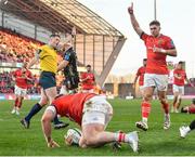 5 March 2022; Jack Crowley of Munster celebrates his side's fourth try, scored by teammate Chris Cloete, front, during the United Rugby Championship match between Munster and Dragons at Thomond Park in Limerick. Photo by Seb Daly/Sportsfile