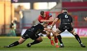 5 March 2022; Gavin Coombes of Munster is tackled by Chris Coleman, left, and Harri Keddie of Dragons during the United Rugby Championship match between Munster and Dragons at Thomond Park in Limerick. Photo by Seb Daly/Sportsfile