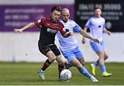 25 February 2022; Darragh Markey of Drogheda United in action against Mark Coyle of Shelbourne during the SSE Airtricity League Premier Division match between Drogheda United and Shelbourne at Head in the Game Park in Drogheda, Louth. Photo by Ramsey Cardy/Sportsfile