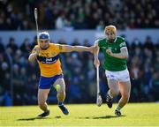 6 March 2022; Adam English of Limerick is tackled by Rory Hayes of Clare during the Allianz Hurling League Division 1 Group A match between Clare and Limerick at Cusack Park in Ennis, Clare. Photo by Ray McManus/Sportsfile