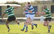 6 March 2022; James Smith of Athy is tackled by Paul O'Connor, left, and Ian Murphy of Balbriggan during the Bank of Ireland Leinster Rugby Provincial Towns Cup 1st Round match between Balbriggan RFC and Athy RFC at Balbriggan RFC in Balbriggan, Dublin. Photo by Ramsey Cardy/Sportsfile