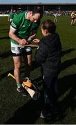 6 March 2022; Richie English of Limerick signs a hurl for a young supporter after the Allianz Hurling League Division 1 Group A match between Clare and Limerick at Cusack Park in Ennis, Clare. Photo by Ray McManus/Sportsfile