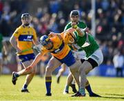 6 March 2022; Richie English of Limerick is tackled by Patrick Crotty of Clare during the Allianz Hurling League Division 1 Group A match between Clare and Limerick at Cusack Park in Ennis, Clare. Photo by Ray McManus/Sportsfile