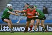 6 March 2022; Ursula Jacob of Oulart the Ballagh is tackled by Sarsfields players, from left, Joanne Daly, Laura Ward, and Kate Gallagher during the 2021 AIB All-Ireland Senior Camogie Club Championship Final between Oulart the Ballagh, Wexford, and Sarsfields, Galway, at Croke Park in Dublin.  Photo by Piaras Ó Mídheach/Sportsfile
