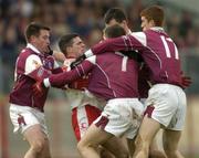 18 April 2004; Mark Harte, Tyrone, is tackled by Tommy Joyce, Sean Og De Paor, (7), Sean O'Domhnaill, (hidden) and Kieran Fitzgerald, (17), Galway. Allianz Football League 2004, Semi-Final, Tyrone v Galway, Healy Park, Omagh, Co. Tyrone. Picture credit; Damien Eagers / SPORTSFILE *EDI*