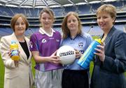 19 April 2004; At the announcment of a major sponsorship deal with Lucozade and Cumann Peil Gael na mBan in Croke Park today are, l to r, Jocelyn Emerson, Head of Mutritionals Marketing GlaxoSmithKline, Martina Farrell, Dublin, Mary Nevin, Dublin and Geraldine Giles, President of the Ladies Football Association. Lucozade Sport is now the official drink of Ladies Gaelic Football. Croke Park, Dublin. Picture credit; David Maher / SPORTSFILE *EDI*