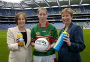 19 April 2004; At the announcment of a major sponsorship deal with Lucozade and Cumann Peil Gael na mBan in Croke Park today are, l to r, Jocelyn Emerson, Head of Mutritionals Marketing GlaxoSmithKline, Cora Staunton, Mayo and Geraldine Giles, President of the Ladies Football Association. Lucozade Sport is now the official drink of Ladies Gaelic Football. Croke Park, Dublin. Picture credit; David Maher / SPORTSFILE *EDI*