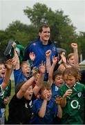 31 July 2013; Leinster's Devin Toner with participants, from the Curragh Camp, during a Leinster Rugby Summer Camp at Cill Dara RFC, Kildare, Co. Kildare. Picture credit: David Maher / SPORTSFILE