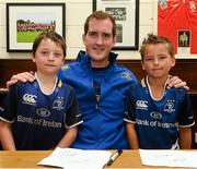 31 July 2013; Leinster's Devin Toner with Harry Sexton, left, and Alex Cross, both aged 8 and from the Curragh Camp, during a Leinster Rugby Summer Camp at Cill Dara RFC, Kildare, Co. Kildare. Picture credit: David Maher / SPORTSFILE
