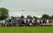 31 July 2013; Leinster's Devin Toner, left, and Kevin McLaughlin with children, from the Curragh Camp, during a Leinster Rugby Summer Camp at Cill Dara RFC, Kildare, Co. Kildare. Picture credit: David Maher / SPORTSFILE
