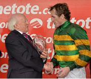 31 July 2013; The President of Ireland Michael D. Higgins presents jockey Tony McCoy with the trophy after victory in the www.thetote.com Galway Plate on Carlingford Lough. Galway Racing Festival, Ballybrit, Co. Galway. Picture credit: Barry Cregg / SPORTSFILE
