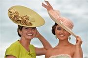 1 August 2013; Carol Kennelly, left, from Tralee, Co. Kerry, and Jennifer Wrynne, from Leitrim, enjoying Ladies Day at the Galway Racing Festival, Ballybrit, Co. Galway. Picture credit: Barry Cregg / SPORTSFILE
