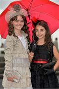 1 August 2013; Ten year old girls Katie Kelly, left, from Roscam, and Ellie Malone, from Knocknacarra, both Co. Galway, enjoying Ladies Day at the Galway Racing Festival, Ballybrit, Co. Galway. Picture credit: Barry Cregg / SPORTSFILE