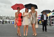 1 August 2013; Charina Rivera, left, from Puerto Rico, Marian O'Hanlon, centre, from Tulla, Co. Clare, and Carola van Duijn, from Holland, enjoying Ladies Day at the Galway Racing Festival, Ballybrit, Co. Galway. Picture credit: Barry Cregg / SPORTSFILE
