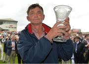 1 August 2013; Trainer Michael Winters with the trophy after he sent out Missunited to win the Guinness Galway Hurdle Handicap. Galway Racing Festival, Ballybrit, Co. Galway.