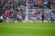 3 August 2013; Dublin supporters in the Davin Stand look on as Bernard Brogan takes a shot at goal which ultimately hit the post and bounced back into play. GAA Football All-Ireland Senior Championship, Quarter-Final, Dublin v Cork, Croke Park, Dublin.