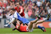 3 August 2013; Conor McManus, Monaghan, is tackled by Sean Cavanagh, Tyrone, assisted by team-mate Colm Cavanagh. GAA Football All-Ireland Senior Championship, Quarter-Final, Monaghan v Tyrone, Croke Park, Dublin. Picture credit: Oliver McVeigh / SPORTSFILE