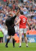 3 August 2013; Sean Cavanagh, Tyrone, receives a yellow card from referee Cormac Reilly following a tackle on Conor McManus, Monaghan. GAA Football All-Ireland Senior Championship, Quarter-Final, Monaghan v Tyrone, Croke Park, Dublin. Picture credit: Oliver McVeigh / SPORTSFILE