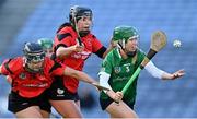 6 March 2022; Laura Ward of Sarsfields in action against Leanne Nolan, left, and Una Leacy of Oulart the Ballagh during the 2021 AIB All-Ireland Senior Camogie Club Championship Final between Oulart the Ballagh, Wexford, and Sarsfields, Galway, at Croke Park in Dublin.  Photo by Piaras Ó Mídheach/Sportsfile