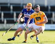 6 March 2022; Ryan McGarry of Antrim in action against Charles Dwyer of Laois during the Allianz Hurling League Division 1 Group B match between Laois and Antrim at MW Hire O'Moore Park in Portlaoise, Laois. Photo by Michael P Ryan/Sportsfile